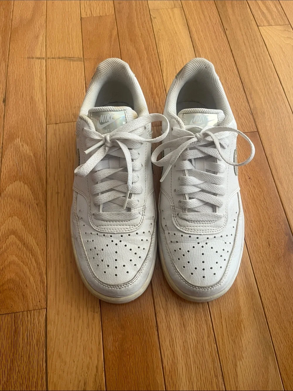 Nike White Low-Top Sneakers with Silver Swoosh Accent